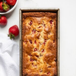 Pan of Strawberry Bread on a white counter from overhead.