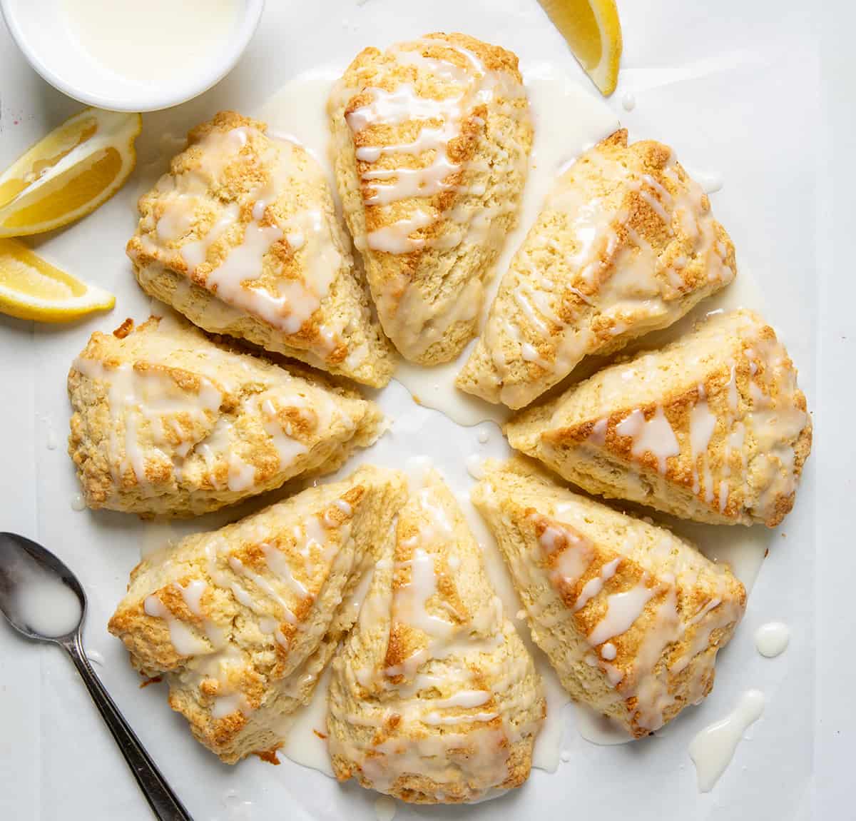 Lemon Scones laid out on a piece of parchment paper after they are baking from overhead.