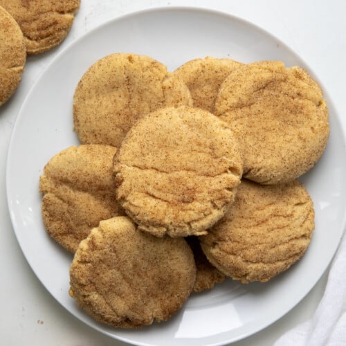 Plate of Peanut Butter Snickerdoodles on a white talbe from overhead.