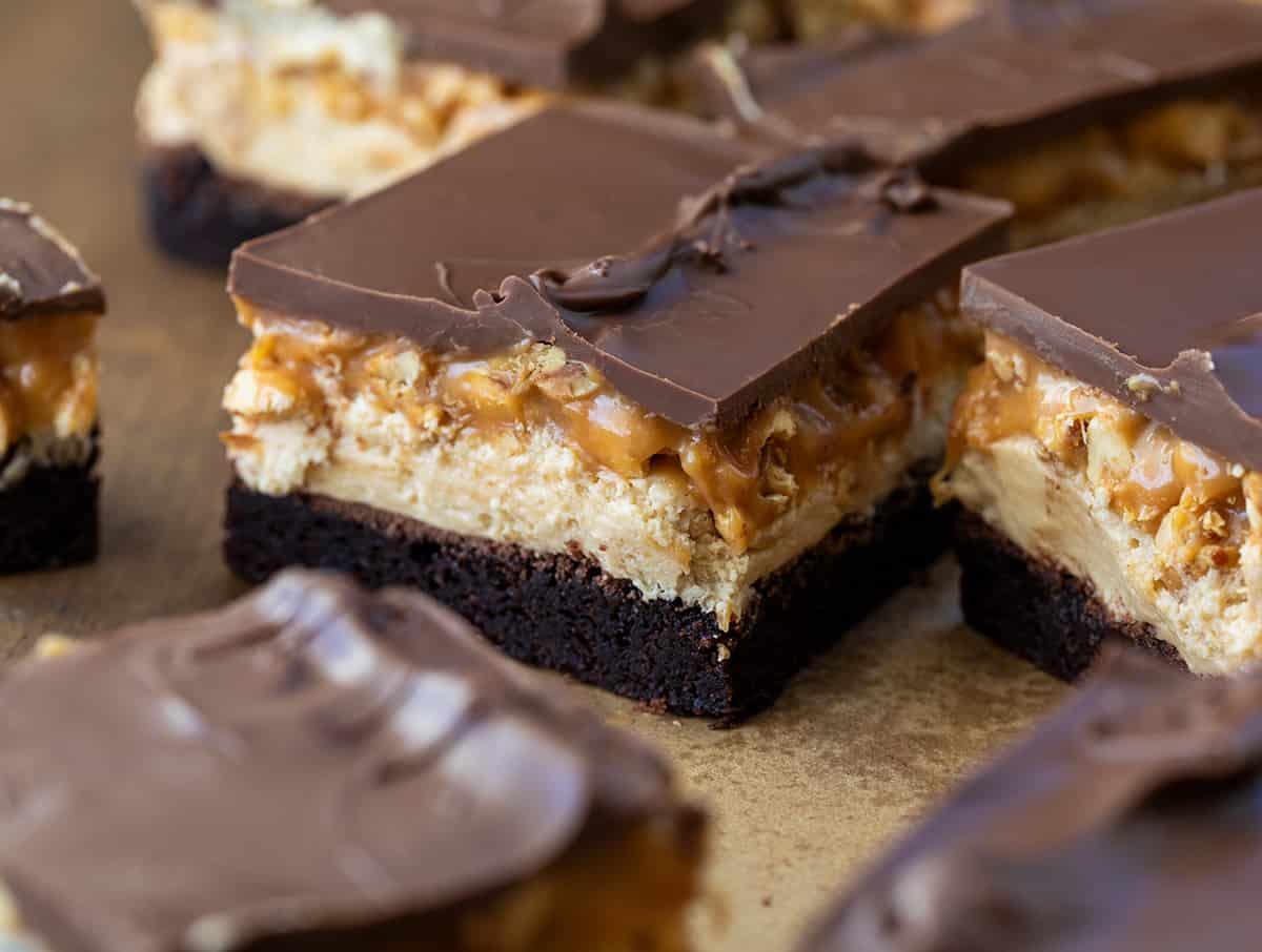 Close up of Snickers Brownies cut into pieces.