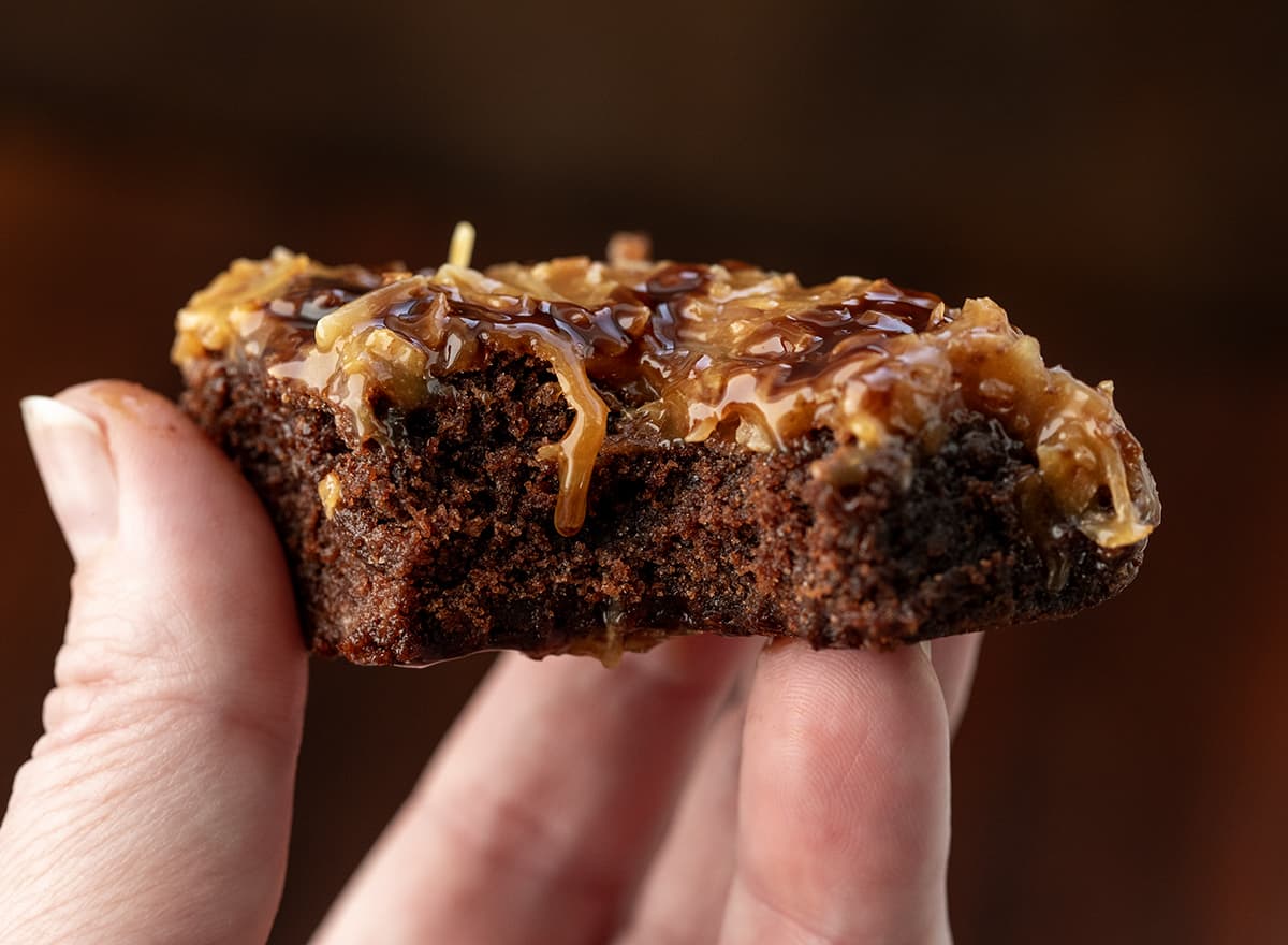 Hand holding a Toasted Coconut Brownie.