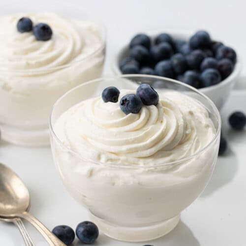 Cup of Easy Cheesecake Mousse with blueberries.