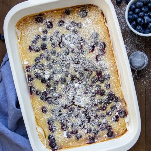 Pan of Lemon Blueberry Bars on a wooden table from overhead.