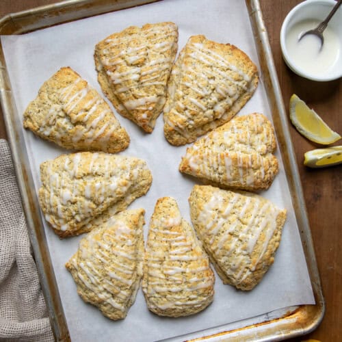 Lemon Poppy Seed Scones on a sheet pan just out of the oven from overhead.