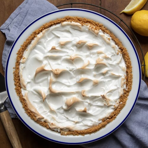Whole Magic Lemon Pie on a wooden table from overhead.