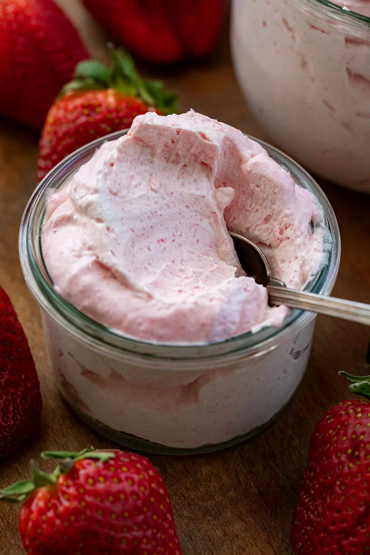 Spoon in a jar of Strawberry Cheesecake Mousse.