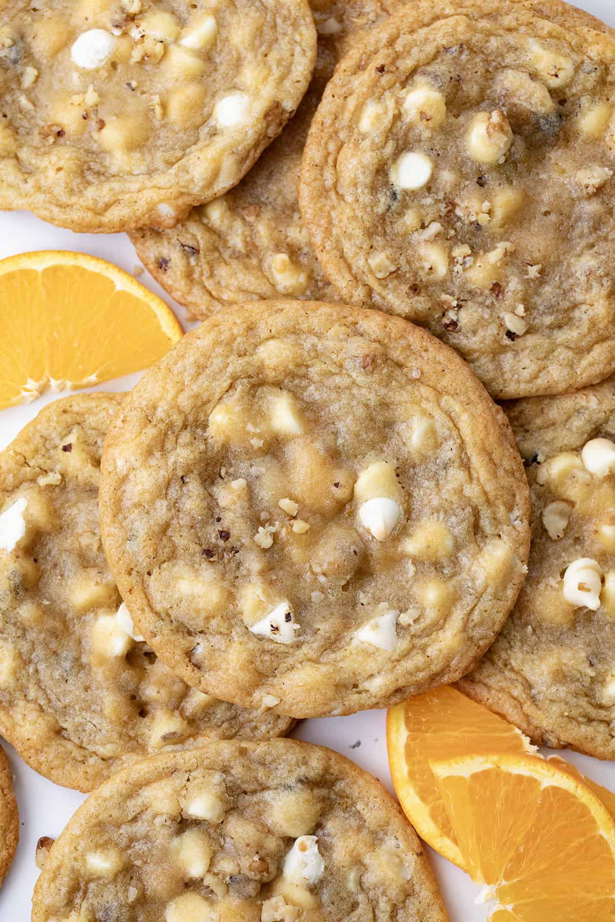 CLose up of White Chocolate Orange Cookies with nuts.