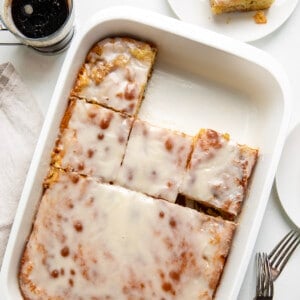 Honey Bun Cake in a pan with some pieces removed from overhead.