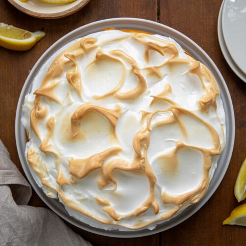 Lemon Meringue Cheesecake on a wooden table arial view.