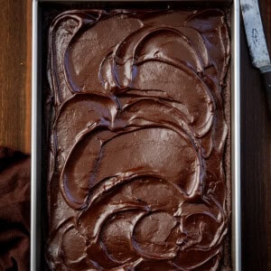 Pan with Double Fudge Whiskey Cake on a wooden table from overhead.