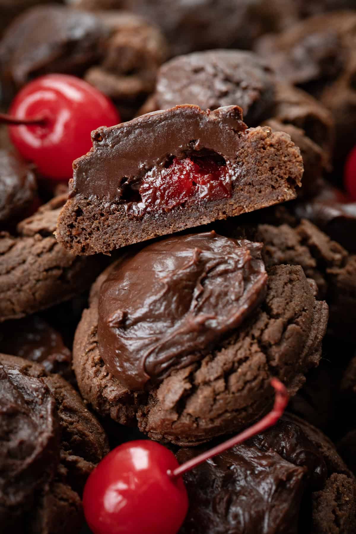 Chocolate Covered Cherry Cookies piled together and one cut in half.