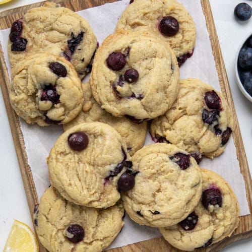 Lemon Blueberry Cookies on a cutting board from overhead.