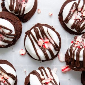 Peppermint Hot Chocolate Cookies on a cooling rack with white parchment paper.