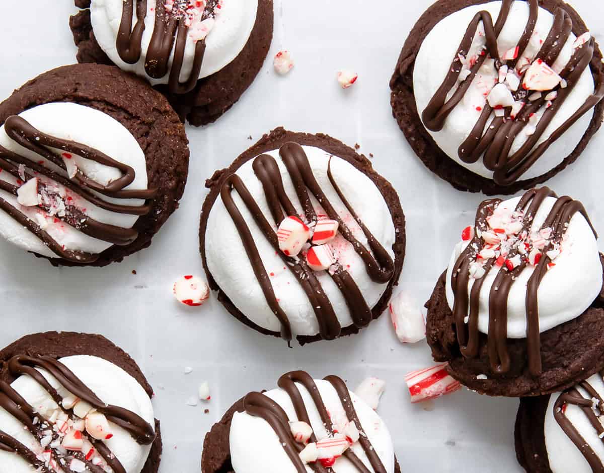 Peppermint Hot Chocolate Cookies on a cooling rack with white parchment paper.