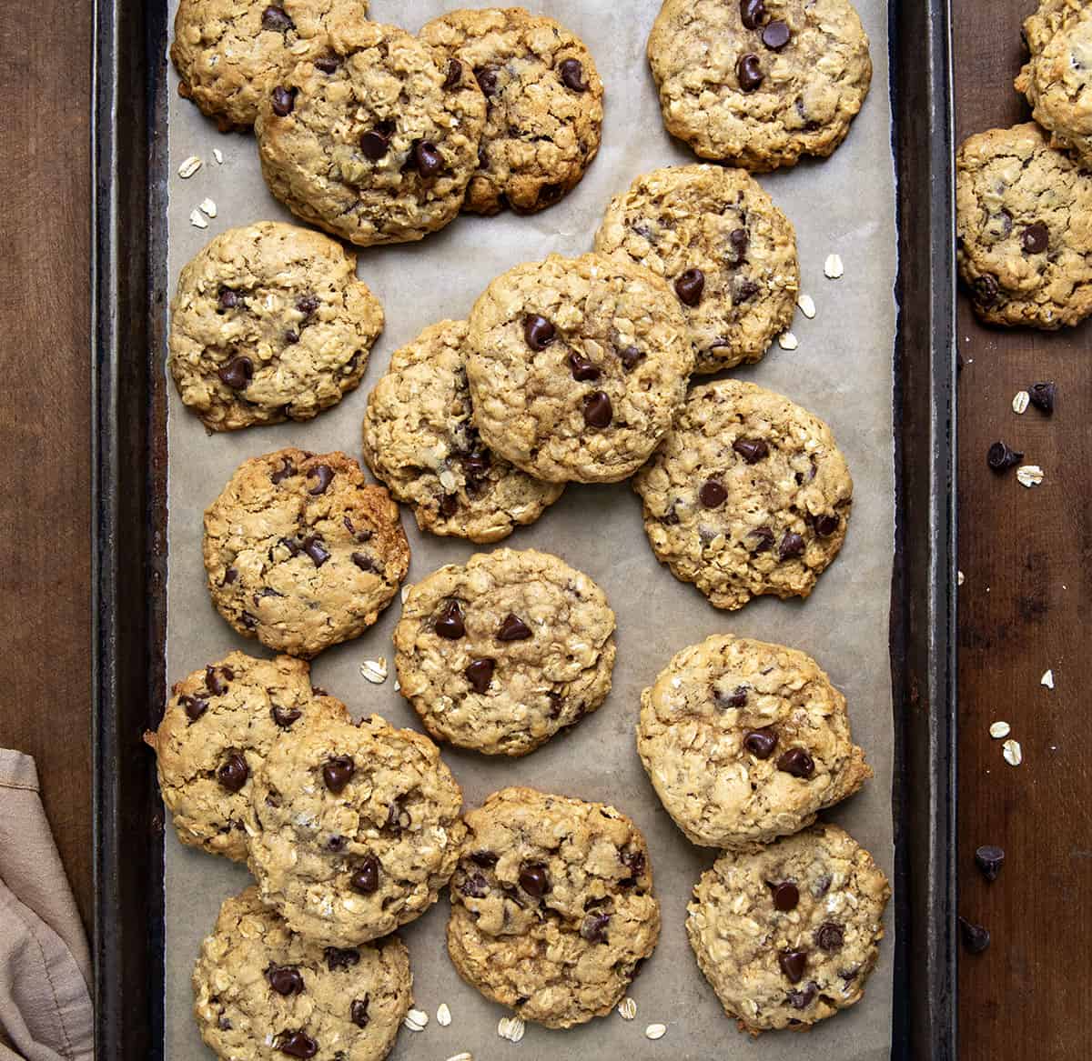 Brown Butter Oatmeal Chocolate Chip Cookies on a tray on a wooden table from overhead.