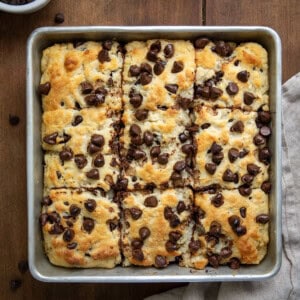 Pan of Chocolate Chip Butter Swim Biscuits on a wooden table.