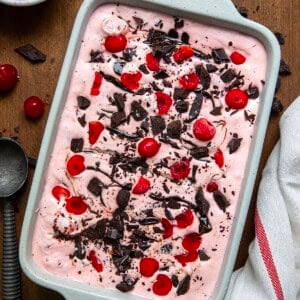 Pan of No Churn Chocolate Cherry Ice Cream on a wooden table from overhead.