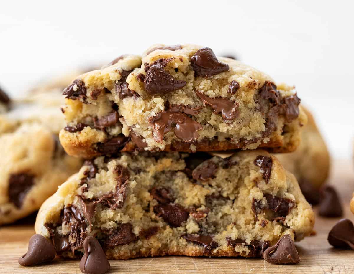 Broken in half thick Chocolate Chip Cookie stacked on itself.