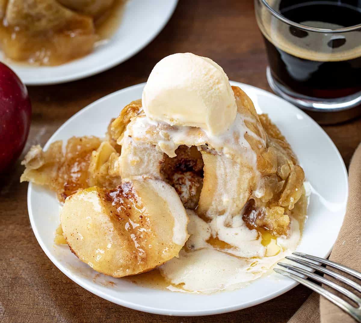 Cut into Apple Dumpling showing whole cooked apple inside.