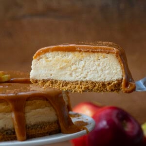 Holding a piece of Apple Cider Cheesecake after removing it from the cake stand.