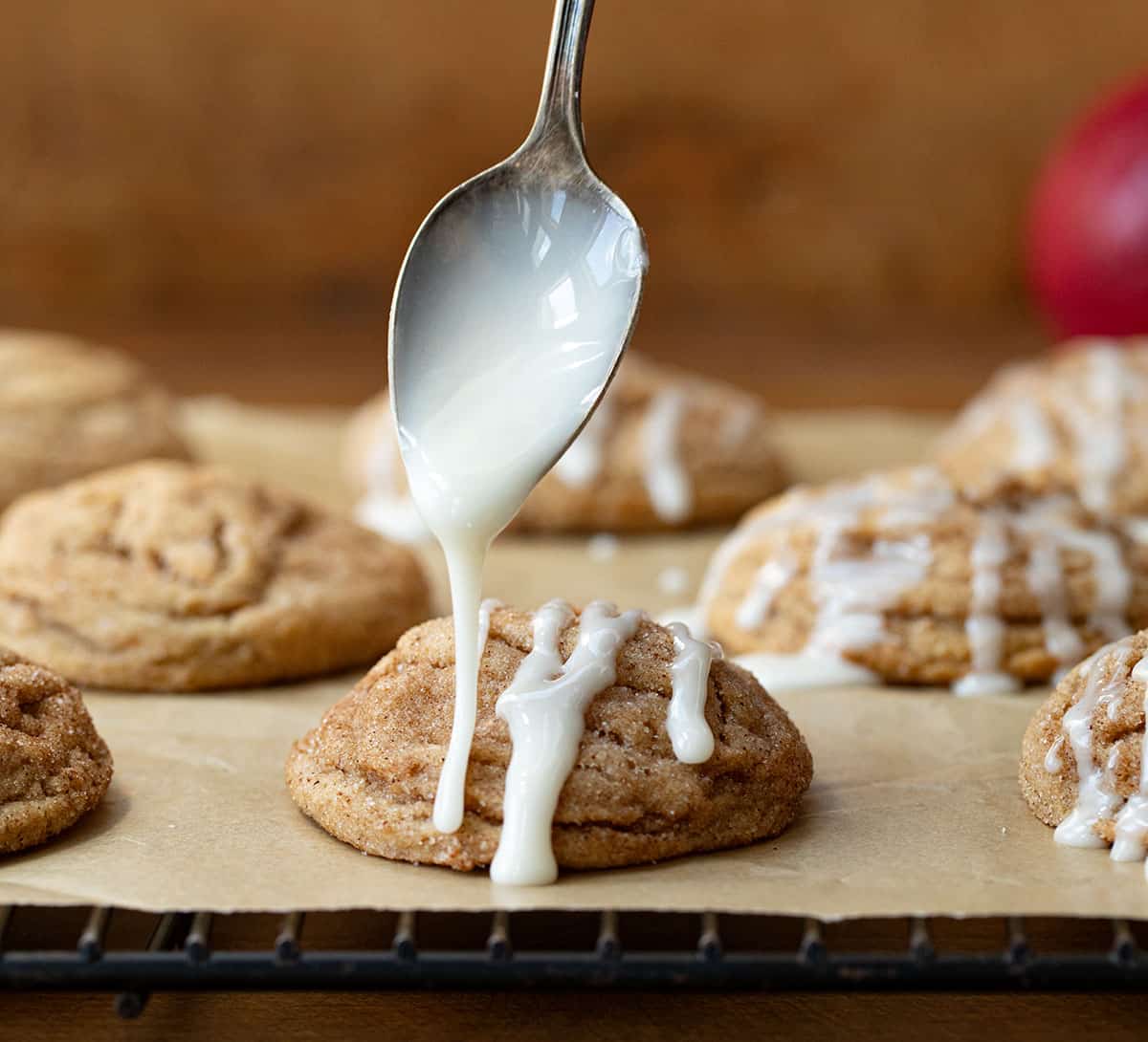 Drizzling glaze over a Apple Cider Cookie.