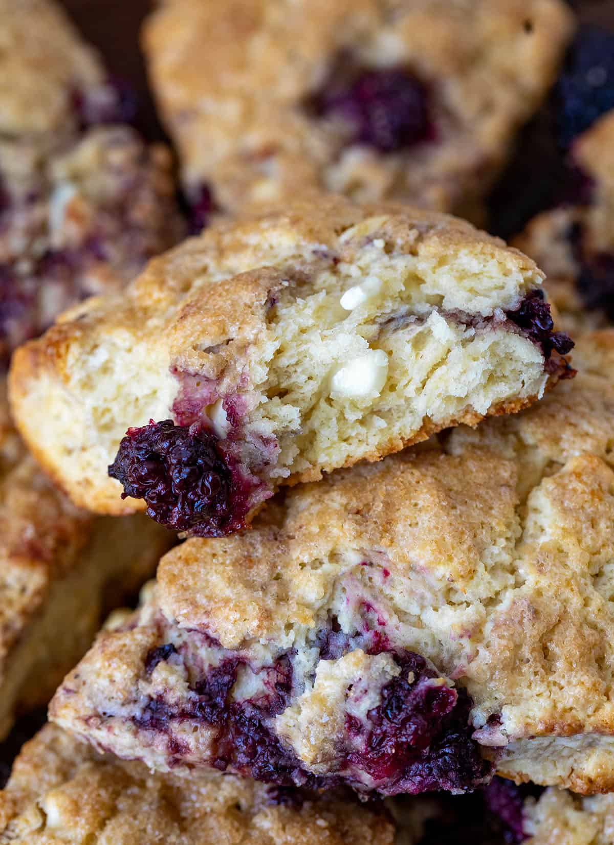 Close up of Blackberry White Chocolate Scones broken in half showing inside texture.