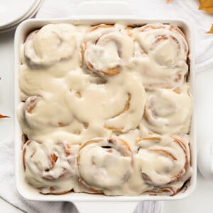 Pan of Maple Cinnamon Rolls on a white table from overhead.