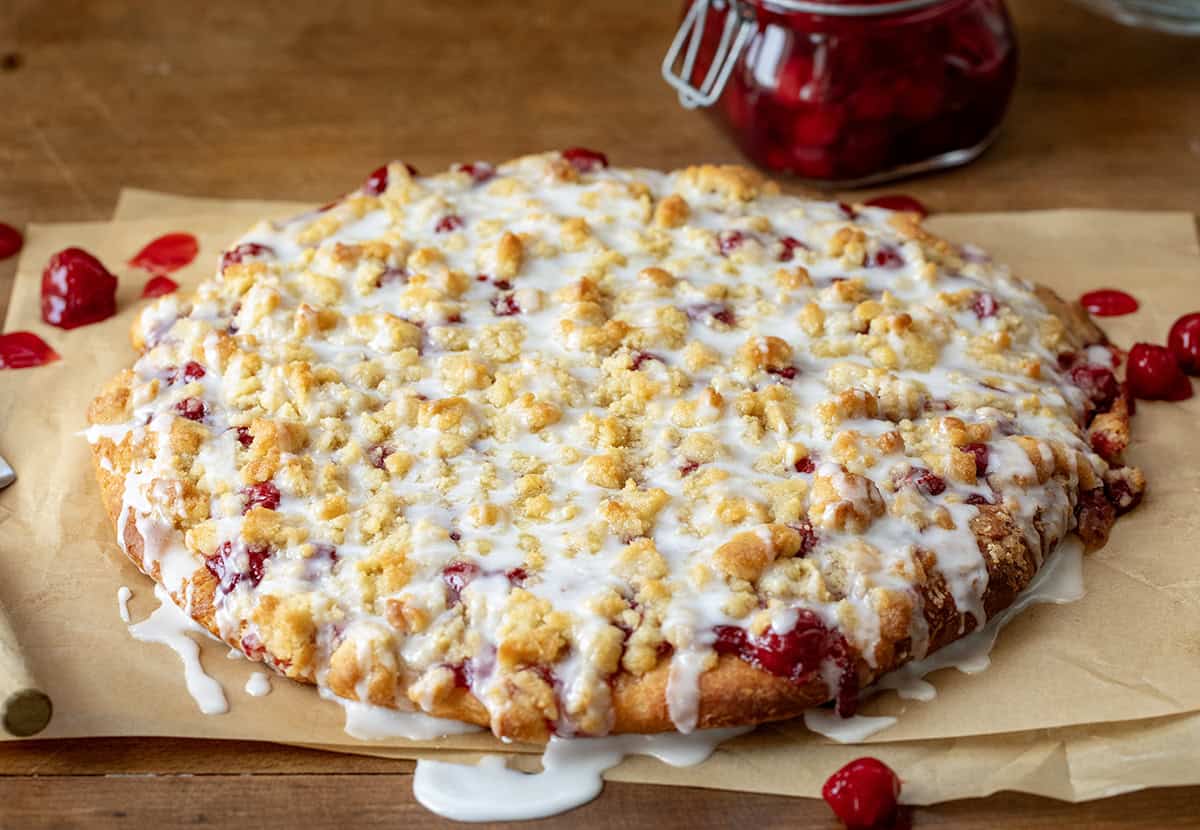 Side view of a glaze covered Cherry Dessert Pizza.