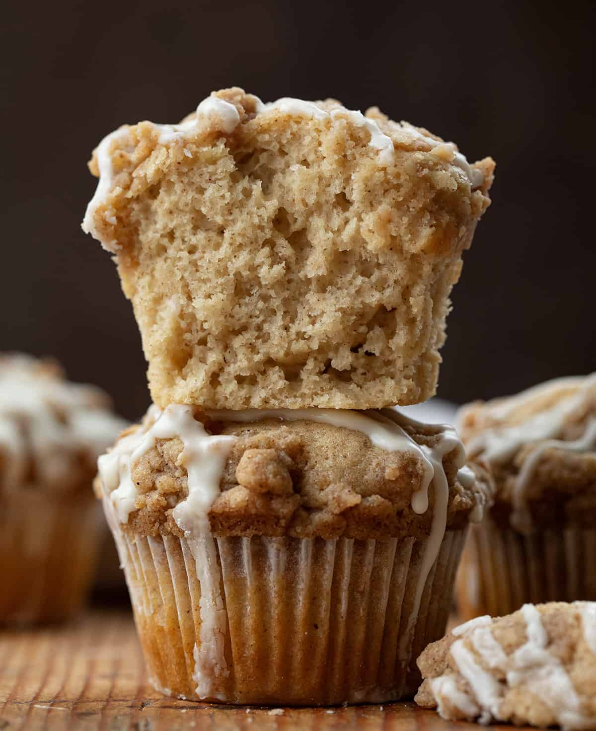 Eggnog Muffins- stacked and top muffin is cut in half showing inside texture.