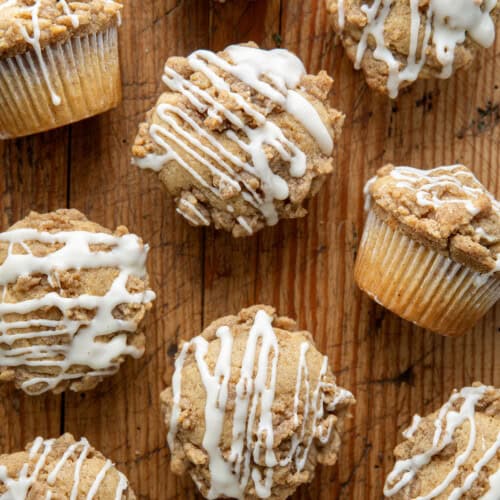 Eggnog Muffins on a wooden table from overhead.