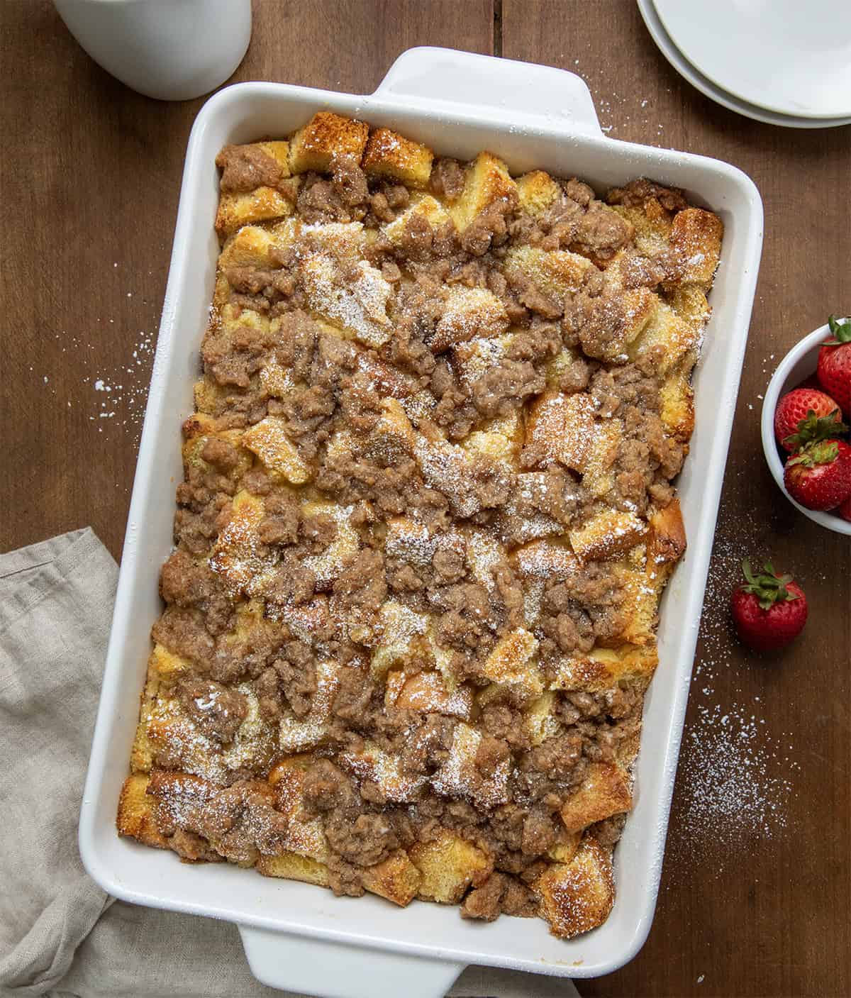 Overnight French Toast Casserole on a wooden table fro overhead.