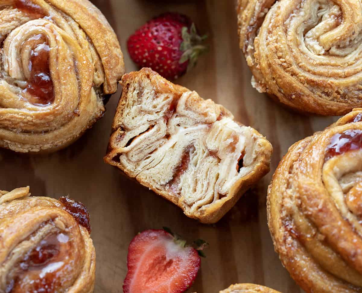 Cut in half Strawberries and Cream Cruffin showing inside layers.