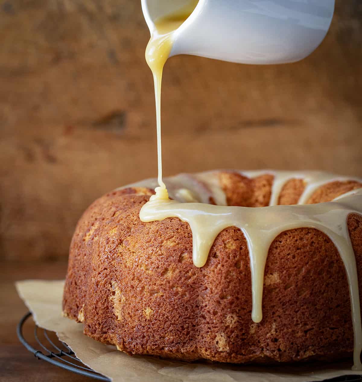 Drizzling glaze over Sweet Potato Pound Cake.