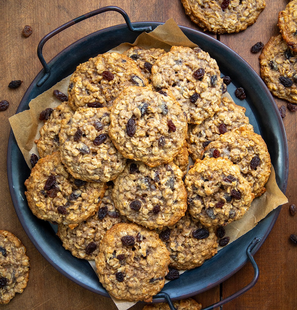 Tray of Oatmeal Raisin Cookies on a wooden table from overhead.