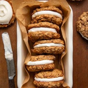 Pumpkin Oatmeal Cream Pies in a loaf pan on a wooden table from overhead.