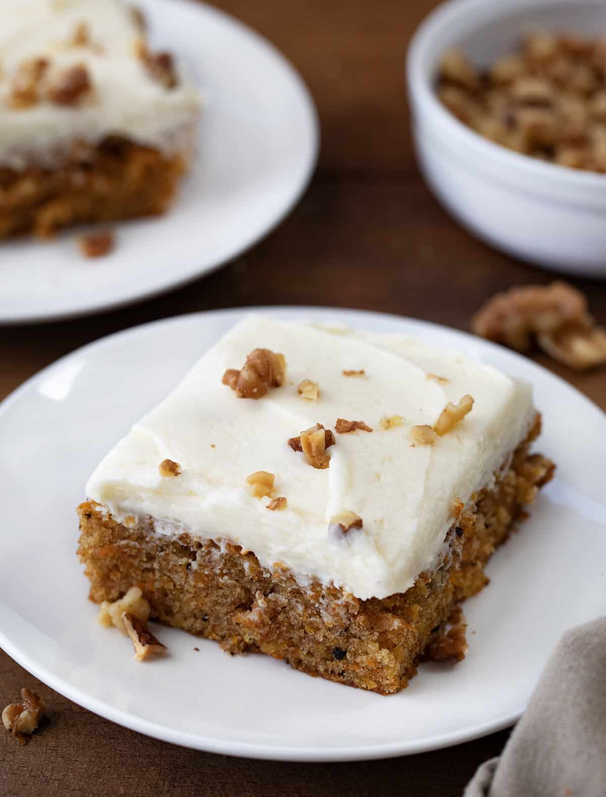 Carrot Cake Bars on white plates close up.