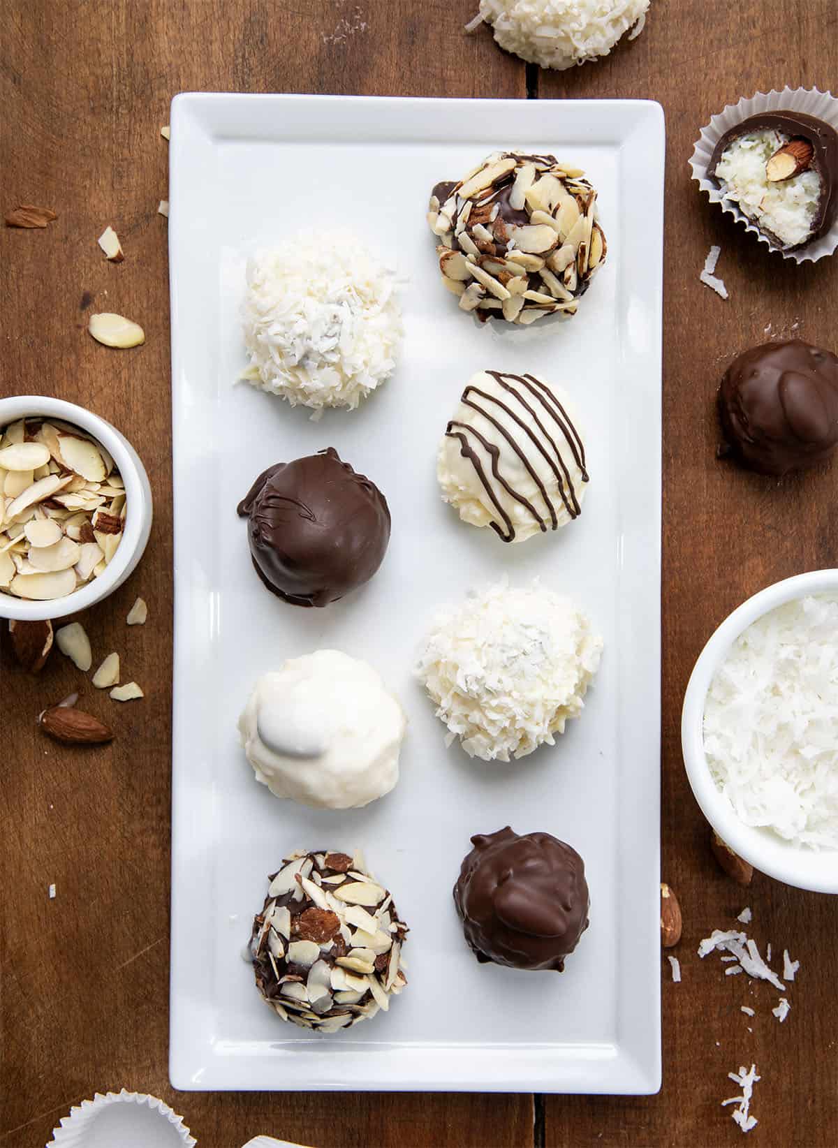 Tray of Almond Joy Truffles on a wooden table from overhead.