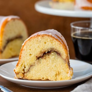 Slice of Cinnamon Swirl Bundt Cake on a white plate.