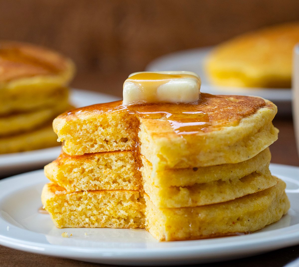 Cut into Cornmeal Pancakes showing fluffy inside and texture.