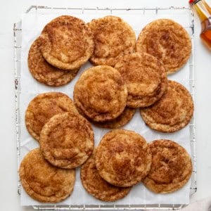 White wire rack with Maple Snickerdoodles on it on a white table from overhead.