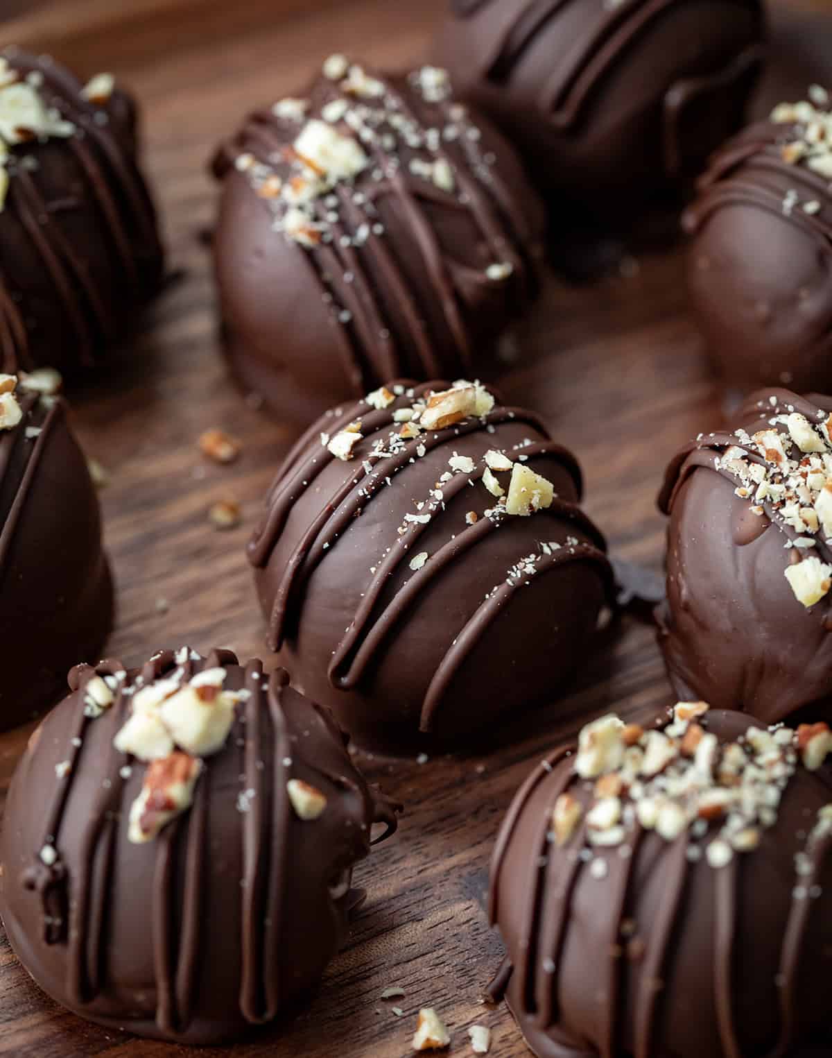 Bourbon Balls on a wooden plate close up.