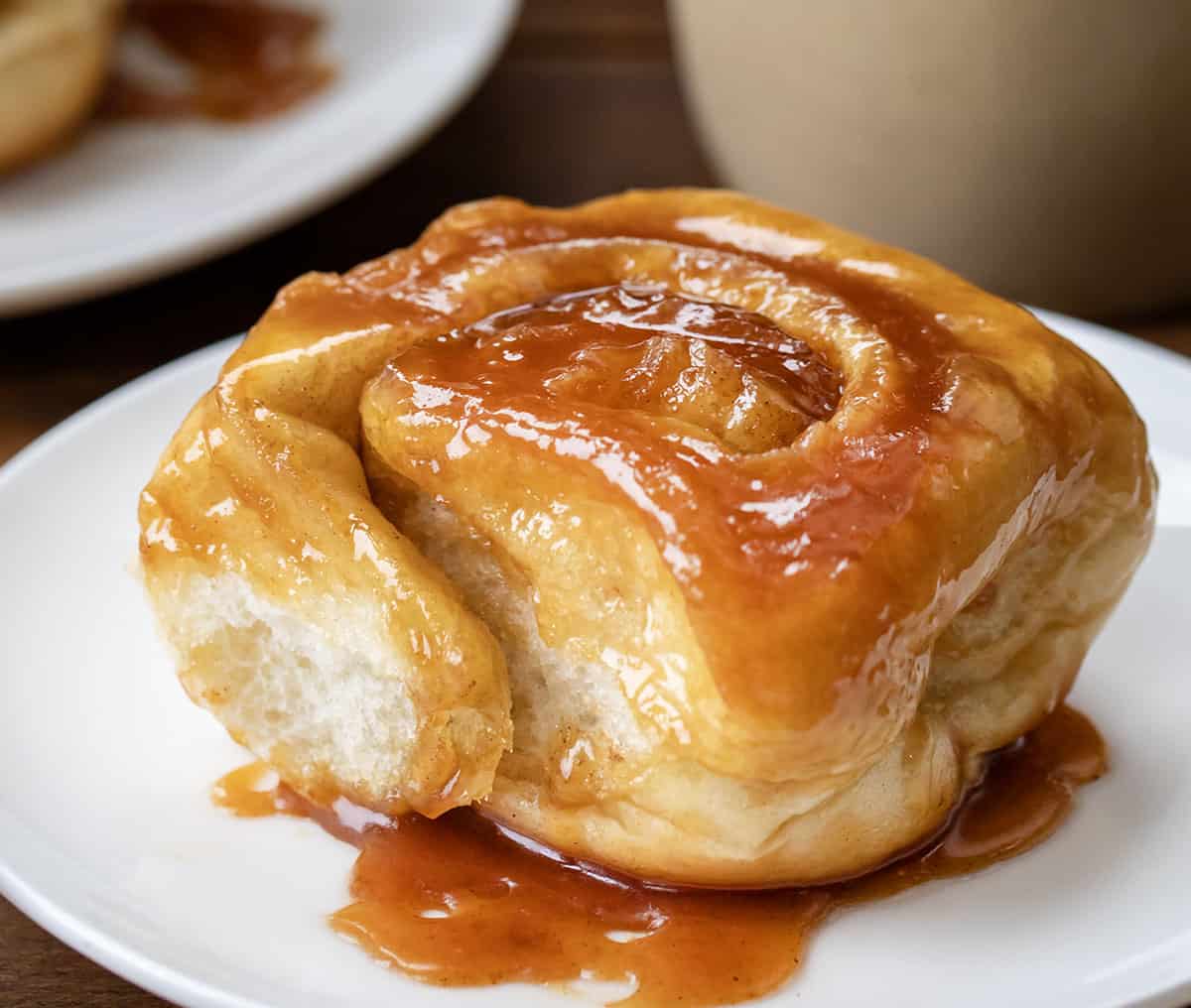 Butterscotch Caramel Roll on a white plate close up.