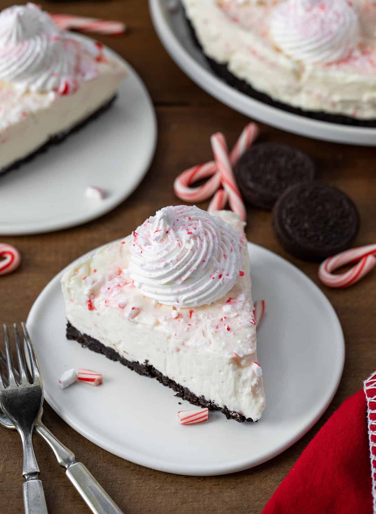 White plates with No Bake Peppermint Cheesecake on them.