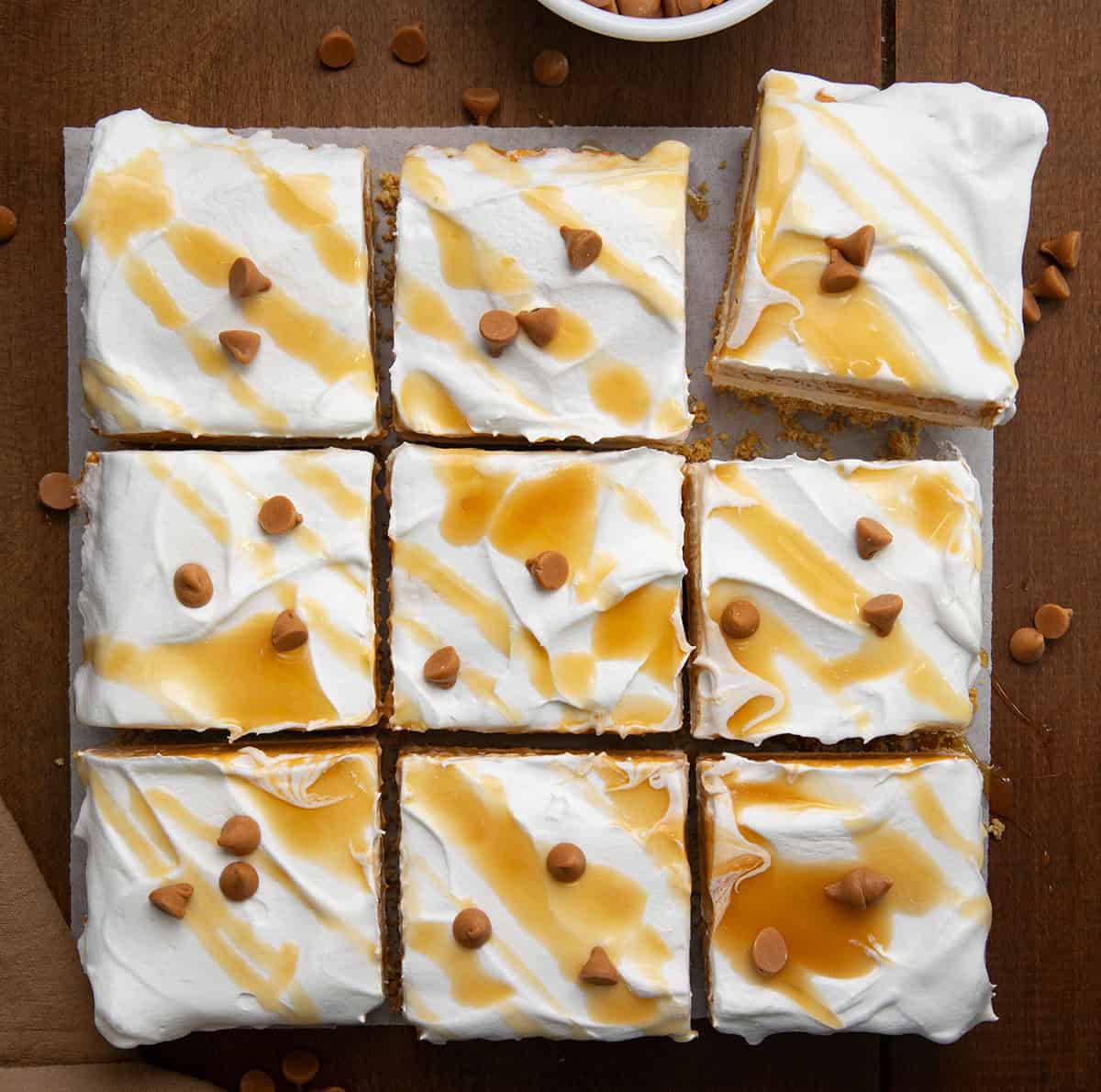 Butterscotch Delight cut into squares on a wooden table from overhead.