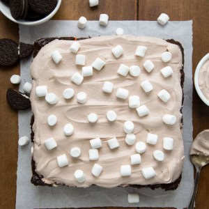 Hot Chocolate Lasagna on a piece of parchment on a wooden table from overhead.