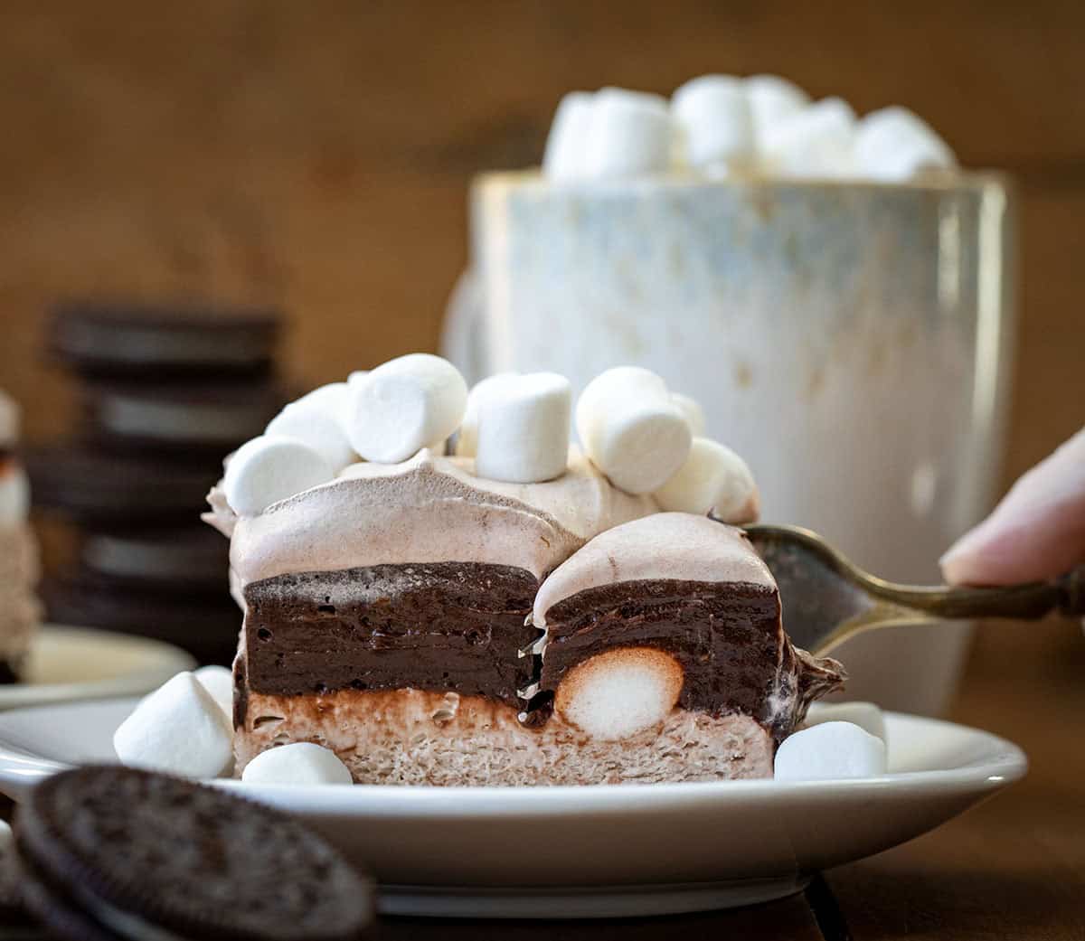 Fork gliding through a piece of Hot Chocolate Lasagna.