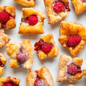 Raspberry Cream Cheese Bites on a white table shot from overhead.