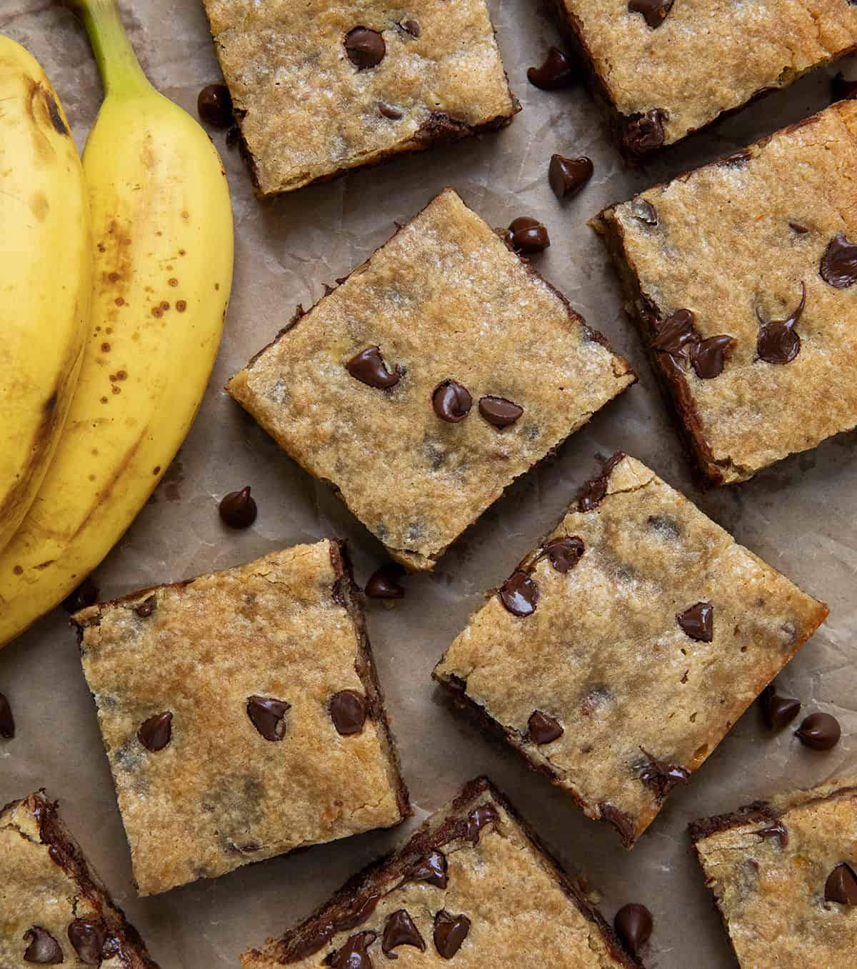 Banana Chocolate Chip Bars cut into squares with bananas from overhead.