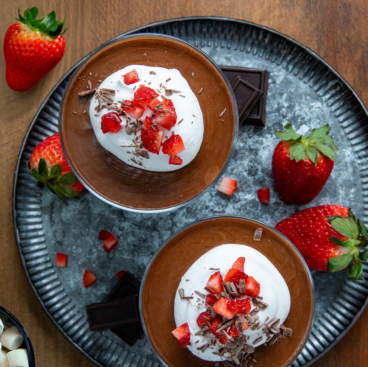 Looking down on a small metal platter with cups of Chocolate Marshmallow Mousse.