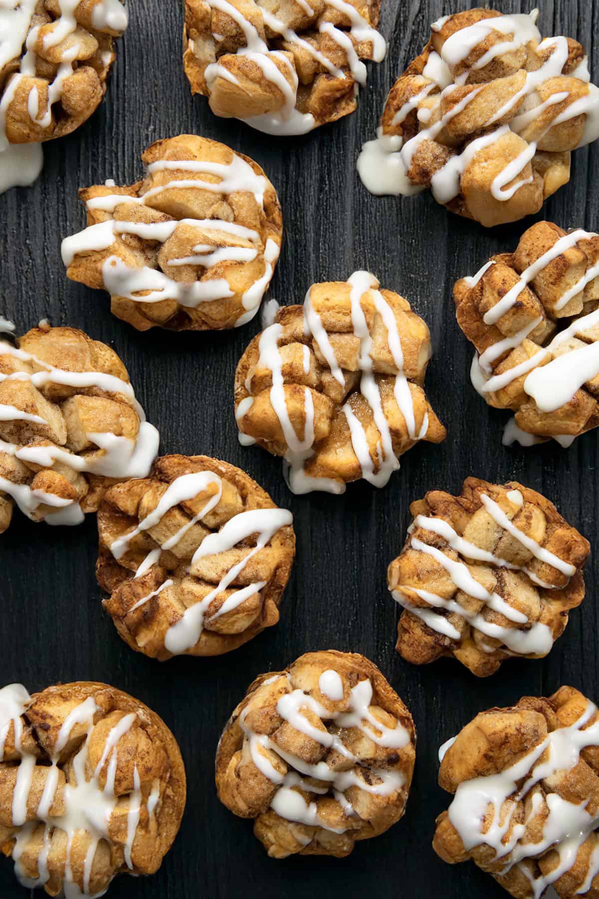 Cinnamon Roll Monkey Bread Muffins on a wooden table from overhead.